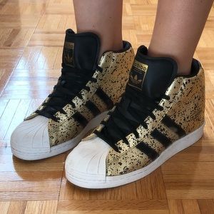 ADIDAS superstar wedge sneaker in black & gold
